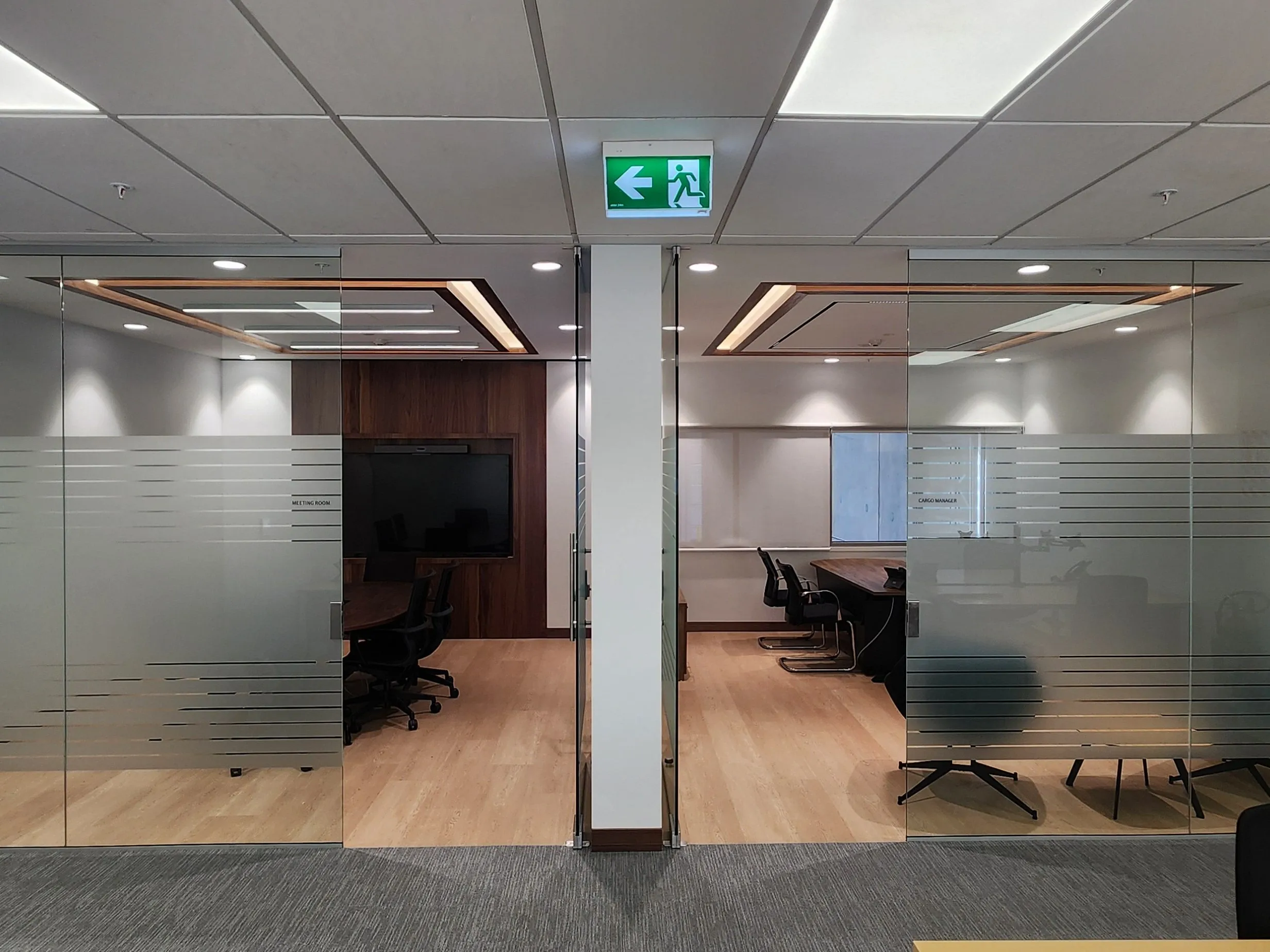 Completed office entrances at the Emirates SkyCargo Lounge fit-out at Auckland Airport.